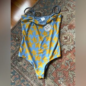 NWT Of One Sea one piece bathing suit. Size medium but fits like a large